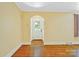 Inviting entryway with hardwood floors, neutral walls, and a classic white front door at 4555 Us 601 Hwy, Salisbury, NC 28147