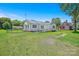 Ranch style home with a metal roof, white siding, a wheelchair ramp and spacious lawn at 4555 Us 601 Hwy, Salisbury, NC 28147