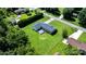 The home features a well-maintained backyard and fenced-in property in an aerial shot at 50 Isenhour Park Rd, Taylorsville, NC 28681