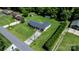Aerial view captures the house situated on a large lot with mature trees and a long driveway at 50 Isenhour Park Rd, Taylorsville, NC 28681