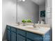 Bright bathroom featuring a double sink vanity with stylish blue cabinets and ample counter space at 50 Isenhour Park Rd, Taylorsville, NC 28681