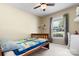 Bedroom features a single bed, natural light, and space for a desk area at 50 Isenhour Park Rd, Taylorsville, NC 28681