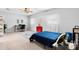 Spacious bedroom features a comfortable bed, neutral carpeting, and abundant natural light from the windows at 50 Isenhour Park Rd, Taylorsville, NC 28681