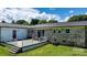Brick-exterior home with a spacious wood deck and fenced-in yard, creating an inviting outdoor living space at 50 Isenhour Park Rd, Taylorsville, NC 28681