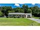 Charming single-story home with a well-maintained lawn and mature landscaping at 50 Isenhour Park Rd, Taylorsville, NC 28681