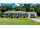 Quaint single-story brick home with well-kept lawn and inviting front porch seating at 50 Isenhour Park Rd, Taylorsville, NC 28681