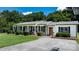 Single-story brick home with a welcoming front porch and neatly manicured lawn at 50 Isenhour Park Rd, Taylorsville, NC 28681