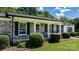Charming front porch with seating, brick accents, and well-maintained landscaping at 50 Isenhour Park Rd, Taylorsville, NC 28681