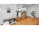 Bright living space showcasing hardwood floors and an opening to the kitchen with a brick accent wall at 50 Isenhour Park Rd, Taylorsville, NC 28681