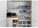 Organized walk-in pantry featuring wire shelving, a microwave, and ample storage space for food and supplies at 50 Isenhour Park Rd, Taylorsville, NC 28681