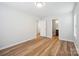 A spacious room featuring wood floors and two doorways with closet at 5375 Eneida Sue Dr, Charlotte, NC 28214
