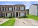 Charming townhouse featuring black shutters and a well-maintained lawn at 5375 Eneida Sue Dr, Charlotte, NC 28214