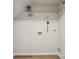 A laundry room featuring a shelf, utility hookup and wood floors at 5375 Eneida Sue Dr, Charlotte, NC 28214