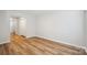 A living room featuring wood floors and access to an entry closet at 5375 Eneida Sue Dr, Charlotte, NC 28214