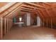 Expansive unfinished attic with wooden beams, offering vast potential for storage or customization at 5890 Alley Rd, Catawba, NC 28609