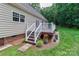 Wooden back deck with white railings and stairs, great for outdoor entertaining at 5890 Alley Rd, Catawba, NC 28609
