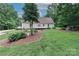 Backyard featuring a large yard, lush landscaping and spacious wooden deck at 5890 Alley Rd, Catawba, NC 28609