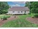 A spacious backyard with a wooden deck and lush landscaping at 5890 Alley Rd, Catawba, NC 28609