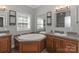 Bright bathroom featuring a soaking tub, dual vanities, and modern fixtures at 5890 Alley Rd, Catawba, NC 28609