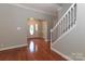 Foyer with hardwood floors, a staircase, and a front door with decorative glass at 5890 Alley Rd, Catawba, NC 28609