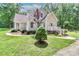 Charming home featuring a well-manicured lawn, attractive landscaping, and inviting front porch at 5890 Alley Rd, Catawba, NC 28609