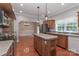 Traditional kitchen with wood cabinets, stainless appliances, and island with sink at 5890 Alley Rd, Catawba, NC 28609
