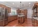 Traditional kitchen with wood cabinets, stainless appliances, and large island at 5890 Alley Rd, Catawba, NC 28609