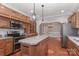 Traditional kitchen featuring custom wood cabinets, stainless appliances, and an island with seating at 5890 Alley Rd, Catawba, NC 28609