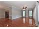 Spacious living room with hardwood floors, neutral walls, and access to the kitchen at 5890 Alley Rd, Catawba, NC 28609