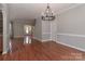 Open living space with hardwood floors, neutral walls, and staircase to the upper level at 5890 Alley Rd, Catawba, NC 28609