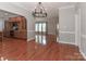 Open living space with hardwood floors, neutral walls, and views of the kitchen and living room at 5890 Alley Rd, Catawba, NC 28609