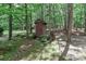Rustic outbuilding nestled among mature trees and natural surroundings at 5890 Alley Rd, Catawba, NC 28609
