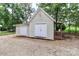 An outbuilding with double doors and a small porch and additional storage is shown at 5890 Alley Rd, Catawba, NC 28609