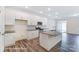 Modern kitchen featuring granite counters, stainless appliances, and white cabinets provides ample storage at 6274 Tea Olive Dr # 237, Harrisburg, NC 28075