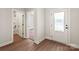 Welcoming entryway featuring wood-look flooring and a view of the bathroom and bedroom at 7106 Jerimoth Dr, Charlotte, NC 28215