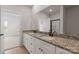 Elegant bathroom with double sinks, granite countertops, and modern fixtures at 7314 Jerimoth Dr, Charlotte, NC 28215