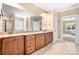 Primary bathroom with double vanity, granite counters, and tile flooring offers space and style at 738 Kemp Rd, Mooresville, NC 28117