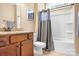 Hall bath featuring wood vanity with granite countertop and shower over tub at 738 Kemp Rd, Mooresville, NC 28117
