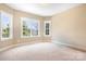 Empty bedroom with natural light, neutral walls, and new carpet at 738 Kemp Rd, Mooresville, NC 28117