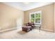 Bedroom with neutral walls, carpet, and natural light from the window at 738 Kemp Rd, Mooresville, NC 28117