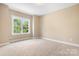 Bedroom with natural light and neutral carpet at 738 Kemp Rd, Mooresville, NC 28117