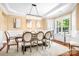 Elegant dining room with hardwood floors, chandelier, and natural light at 738 Kemp Rd, Mooresville, NC 28117