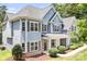 Charming two-story home with gray siding, large windows, and covered front entrance at 738 Kemp Rd, Mooresville, NC 28117