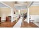 Bright, two-story foyer with hardwood floors and staircase leading to the second level at 738 Kemp Rd, Mooresville, NC 28117