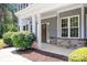 Charming front porch with stone accents, offering curb appeal and a welcoming entrance to this home at 738 Kemp Rd, Mooresville, NC 28117