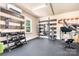 Home gym with workout equipment and rubber flooring at 738 Kemp Rd, Mooresville, NC 28117