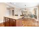Open kitchen with granite island and counter seating near dining area at 738 Kemp Rd, Mooresville, NC 28117