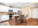 Updated kitchen featuring stainless steel appliances and a central island with bar stools at 738 Kemp Rd, Mooresville, NC 28117