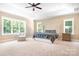 Spacious primary bedroom with a large bed and plenty of natural light at 738 Kemp Rd, Mooresville, NC 28117