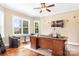 Cozy home office with large desk, hardwood floors, and natural light at 738 Kemp Rd, Mooresville, NC 28117